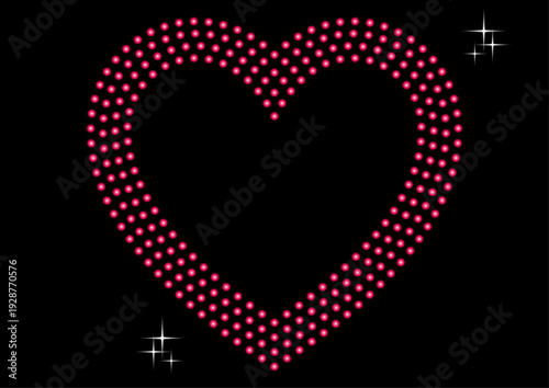 キラキラ輝くピンク色のドットのハート　黒背景