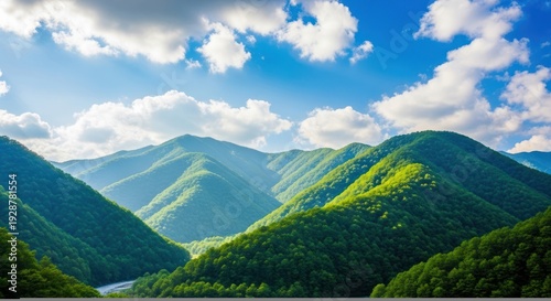 Serene Green Mountains Under Blue Sky.
