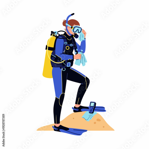 Female scuba diver in wetsuit and full gear preparing for an underwater adventure, wiping her mask on a sandy shore.