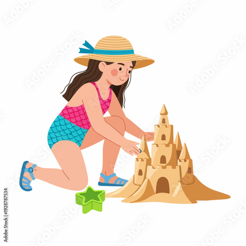 Cute young girl in a straw hat and swimsuit happily building a sandcastle at the beach, enjoying summer vacation activities.