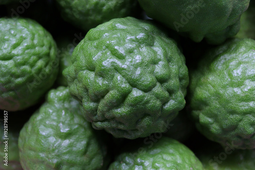 pile of kaffir limes, medicinal herbs, and spices used in cooking.