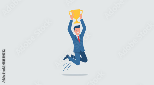 Successful businessman jumping for joy holding a gold trophy cup to celebrate work achievement and professional victory. Concept of career growth, leadership, winning, and business success.