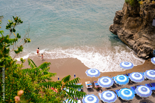 Mother and daughter on a beach in Amalfi coast, Italy