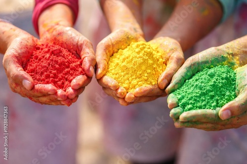hands holding colours during holi 