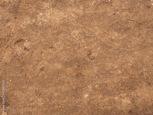 Rough organic brown ground texture a dirtied earth background of natural land. Soil Texture