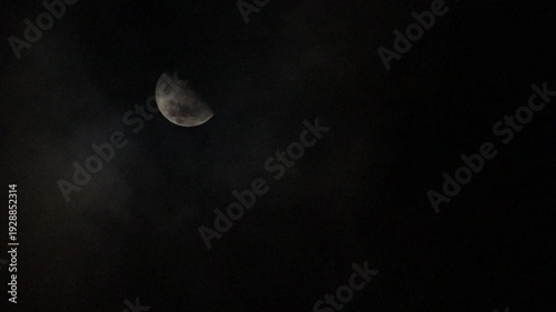 half moon and clouds at night