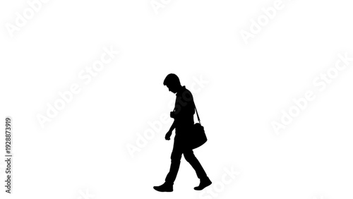 Silhouette of a man walking alone, carrying a bag, depicting a contemplative or busy urban journey