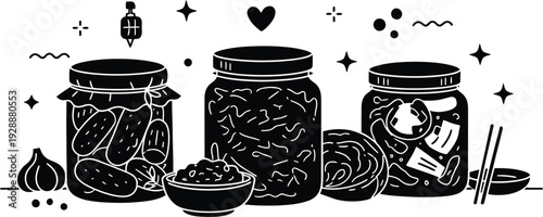 Selection of fermented foods and pickles in glass jars with garlic and traditional snacks