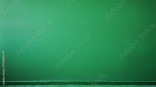 Empty green wall background with wooden baseboard and clean floor