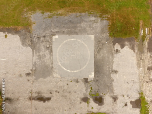 Wallpaper Mural Aerial view of a concrete helipad surrounded by grass and dirt Torontodigital.ca
