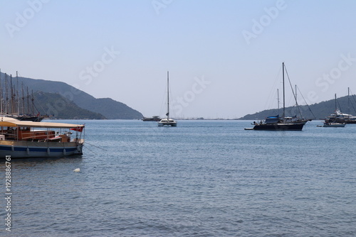 Wallpaper Mural Sailboats moored near calm shoreline with distant hills on clear day Torontodigital.ca