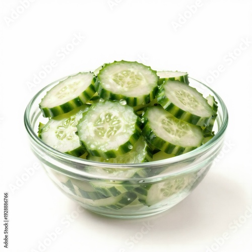 Fresh sliced cucumber on white plate isolated background