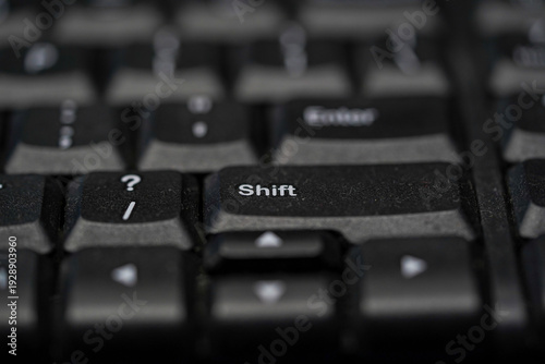 Schilderij op canvas Macro Shot of a Black Computer Keyboard with Focus on the Shift and Enter Keys