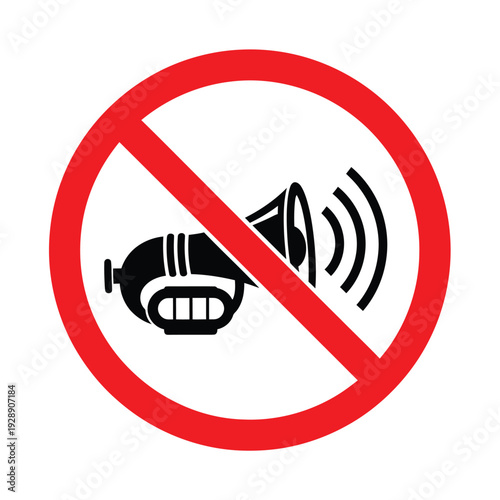 A clear graphic sign indicating no honking or silence, featuring a black horn with sound waves crossed out by a red circle and diagonal line on a white background.