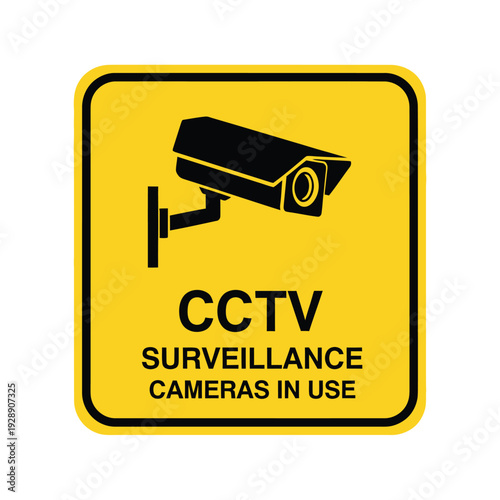 Yellow square sign with a black CCTV camera icon and text 'CCTV SURVEILLANCE CAMERAS IN USE' indicating active security monitoring.