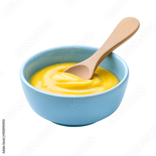 Wooden spoon in creamy yellow baby food puree bowl isolated on transparent background