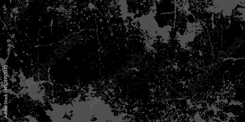 Abstract black and white grunge background featuring a vintage floral pattern with ink textures and a dirty paper border design