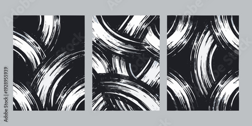 Abstract triptych featuring bold sweeping brushstroke patterns in black and white
