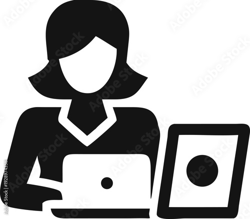 Female office worker multitasking efficiently with her laptop and a digital tablet device