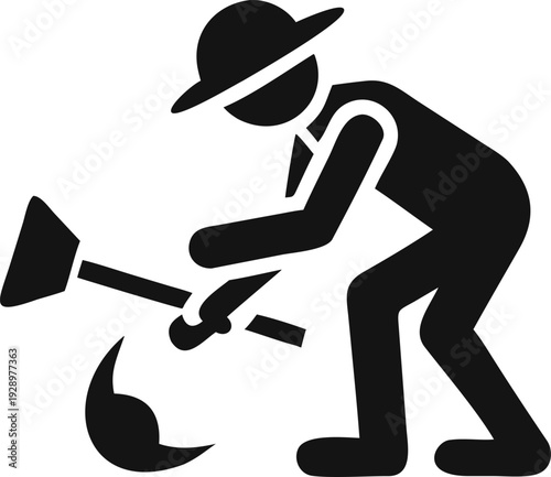 Gardener wearing a hat digging earth with a small hand tool for planting or cultivation