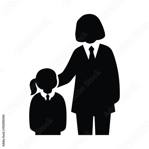 Silhouette of a teacher and student standing closely together