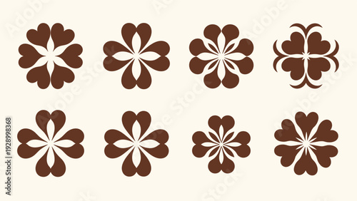 Collection of brown stylized floral symbols created from heart shapes arranged in circular patterns on cream paper.