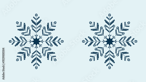 Two intricate blue snowflake designs with geometric patterns isolated on a light blue background for winter holiday decorations.