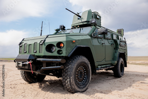 Foto Military armored vehicle on the battlefield