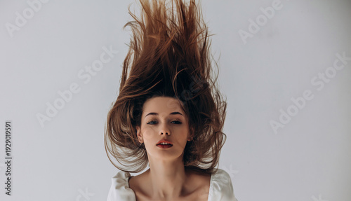 Tableau sur toile Beauty portrait of a model, a beautiful brunette girl with straight long hair in