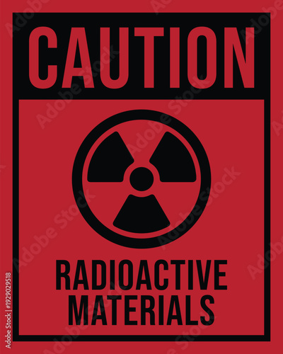 Warning sign featuring red rectangular background with black border radioactive symbol and bold text indicating hazardous materials safety alert