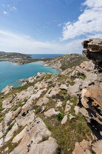 View of the rocky, lush and hilly Paros Park and the Aegean Sea on Paros island in Greece viewed from above on a sunny day.