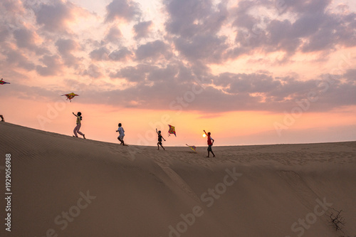 Bild auf Leinwand Life of Cham Women and Children on Nam Cuong Sand Dunes at Sunset, Ninh Thuan, V