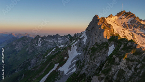 Aerial, bird view, Sunset on Säntis Alpstein mountain in Switzerland. Amazing sunset, impressive mountains with rocky peaks and slopes. Wonderful nature, alps of Switzerland. Hiking outdoor travel des