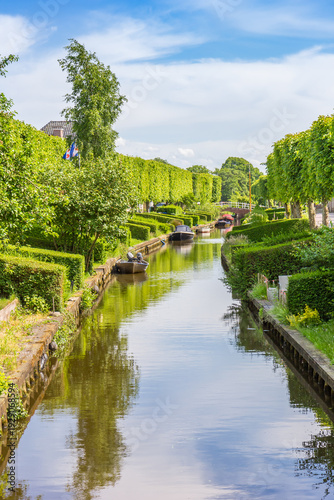 Small boats at the central canal of IJlst, Netherlands