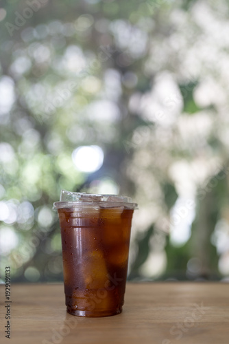 Wallpaper Mural A glass of black coffee or iced americano against nature background Torontodigital.ca