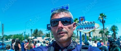 Wallpaper Mural Happy male tourist making a selfie in front of famous Welcome to fabulous Las Vegas sign Torontodigital.ca
