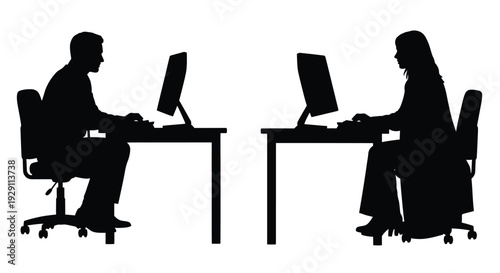 Two people working at desks computers visible in a stark black and white silhouette