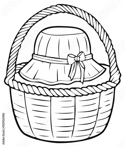 Wicker picnic basket with a festive hat and bow for celebration