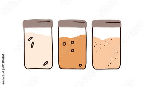 Grains and cereals in glass containers, storage jars closed with lids. Pantry...