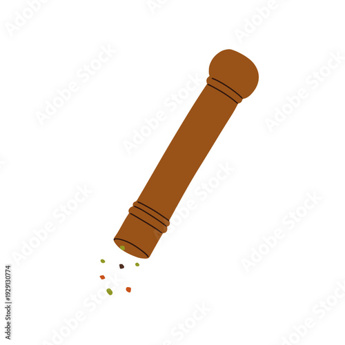 Pepper mill, wooden peppercorn grinder with spice sprinkles. Adding seasoning...
