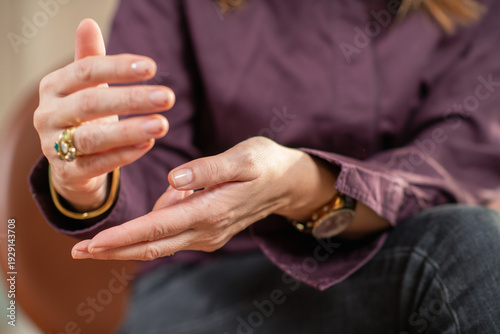 EMDR bilateral self tapping exercise performed by a woman to assist trauma processing. Emphasizes consistency, attention, and therapeutic self-regulation.