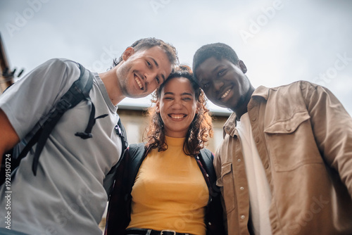 Tableau sur toile Happy students smiling together outdoors: embracing diversity and friendship on