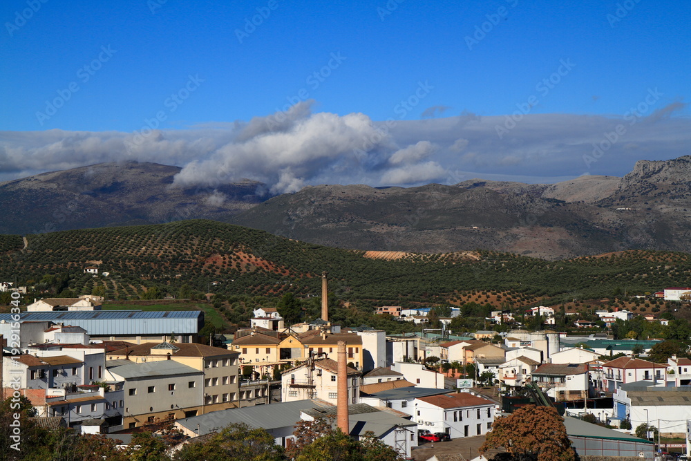 Obraz premium White Andalusian Village Promenade With Balconies Overlooking Mountain Valley