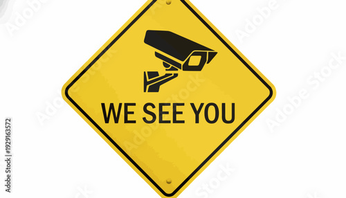 A close-up view of a yellow warning sign with a security camera and the text 'WE SEE YOU' in a black font on a sign.