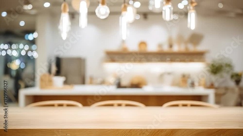 Empty wooden table with blurred cafe interior and warm lighting background