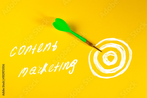 content marketing concept on white background with green pencils