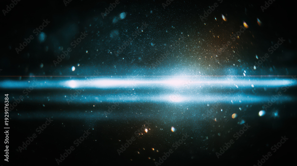 Fototapeta premium A bright blue light streaks across a dark space background