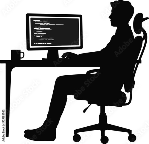 A man sitting at a desk in front of a computer