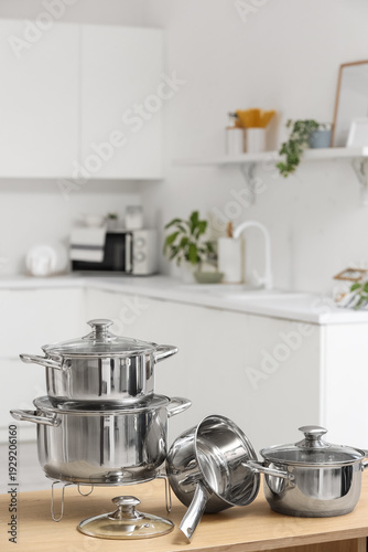 Stainless cooking pots on w...