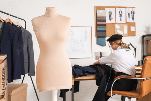 Mannequin against female ta...